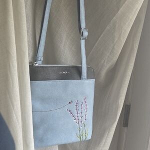 Elegant Blue Crossbody Bag with Lavender Embroidery